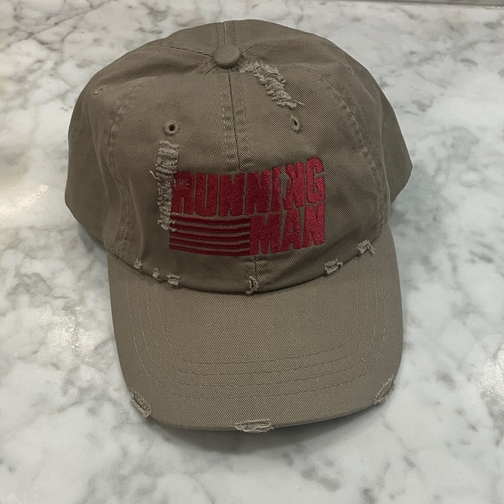 NWOT- the Running Man Movie Promo baseball hat Distressed Tan brown adjustable